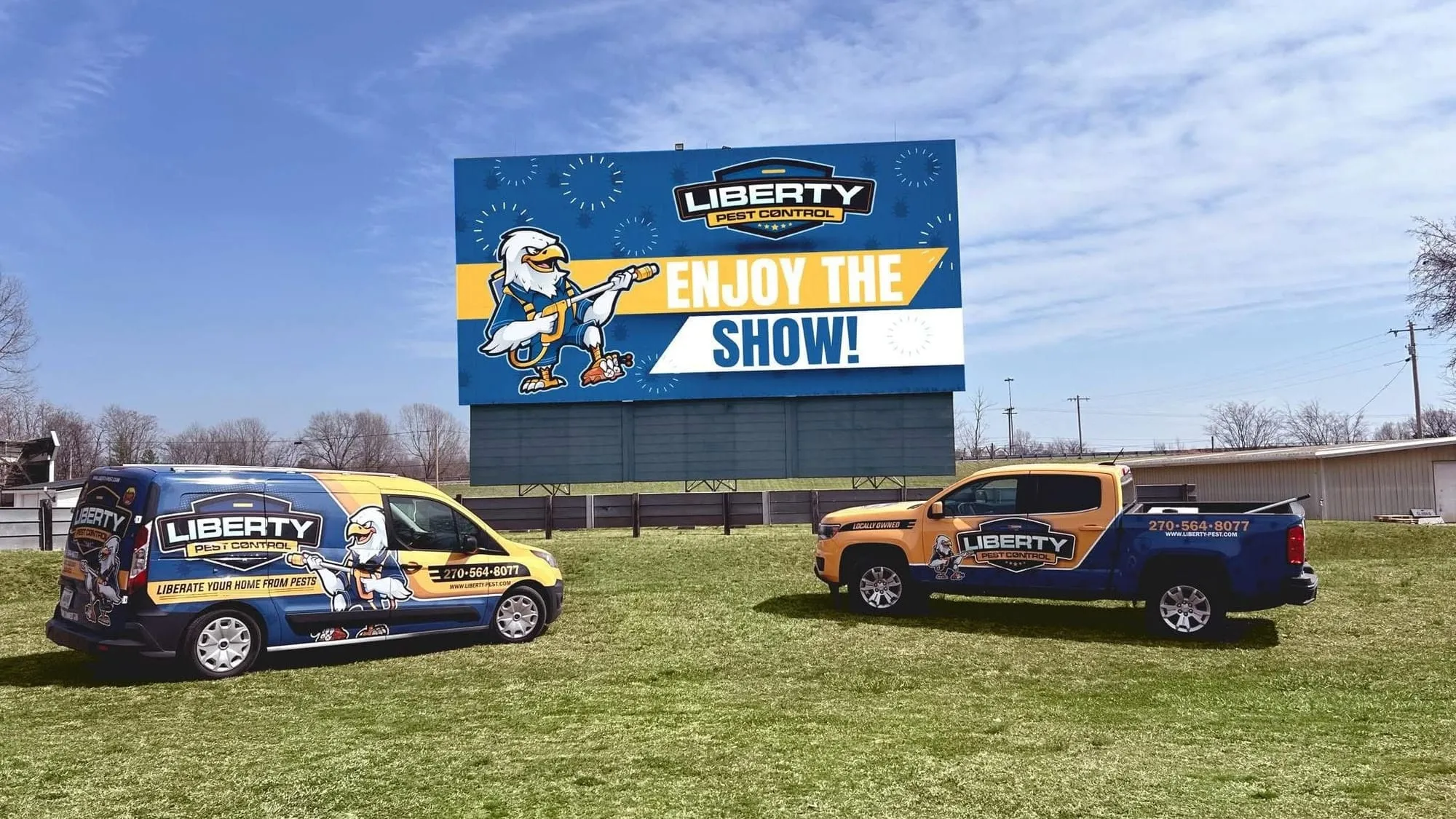 Liberty Pest Control van and truck in front of the Calvert City drive-in theater screen