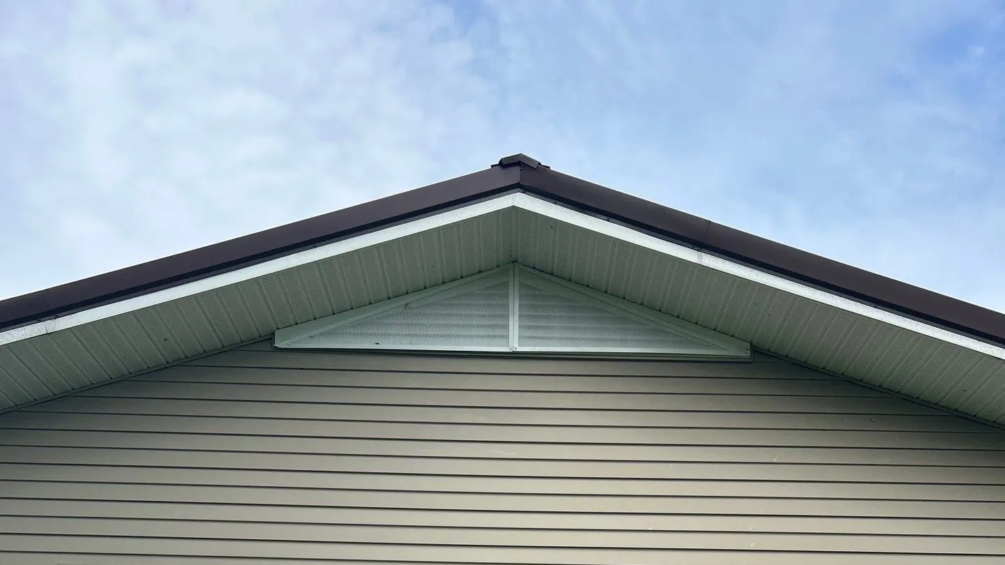 Finished guard over a louvered gable vent on a house