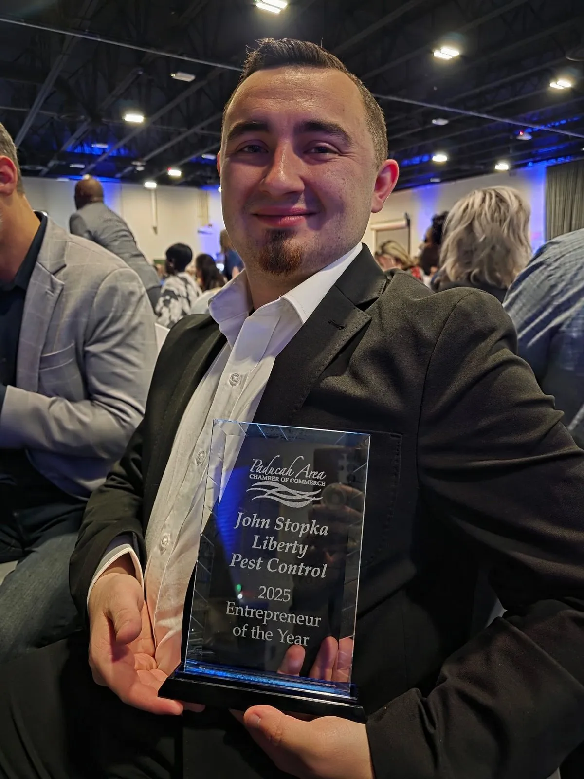 John Stopka holding his Paducah Area Chamber of Commerce 2025 Entrepreneur of the Year award