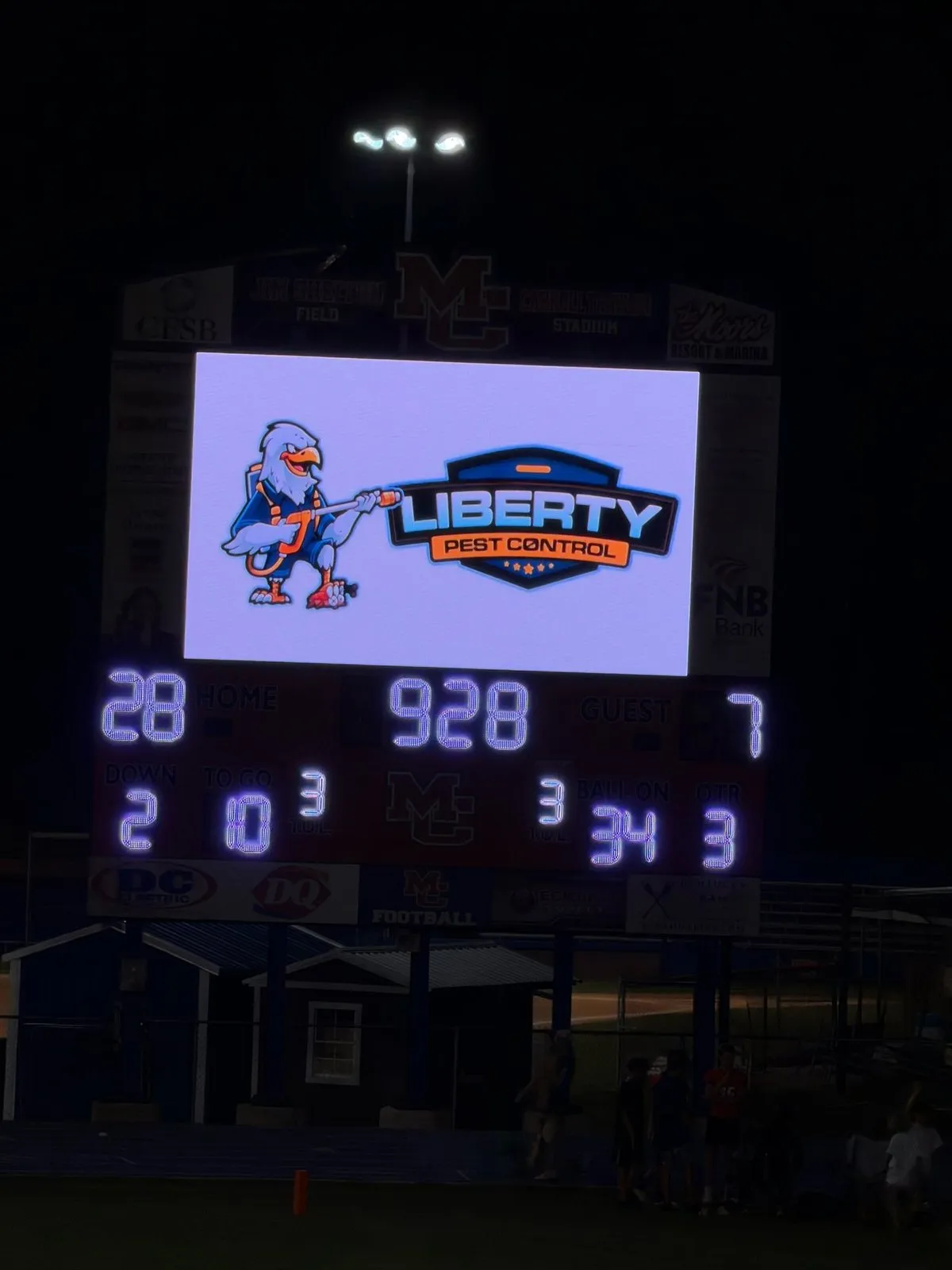 Liberty Pest Control ad on the Marshall County High School football scoreboard