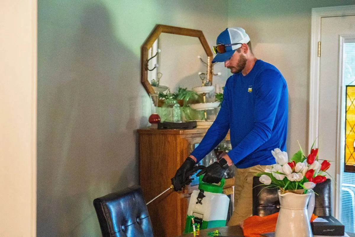 Liberty Service Specialist preparing a sprayer in a customer's dining room